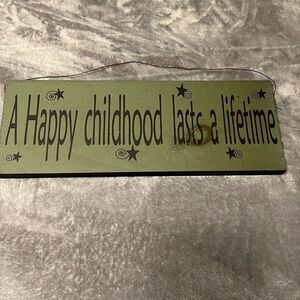 “A Happy Childhood Lasts a Lifetime” Wooden Sign